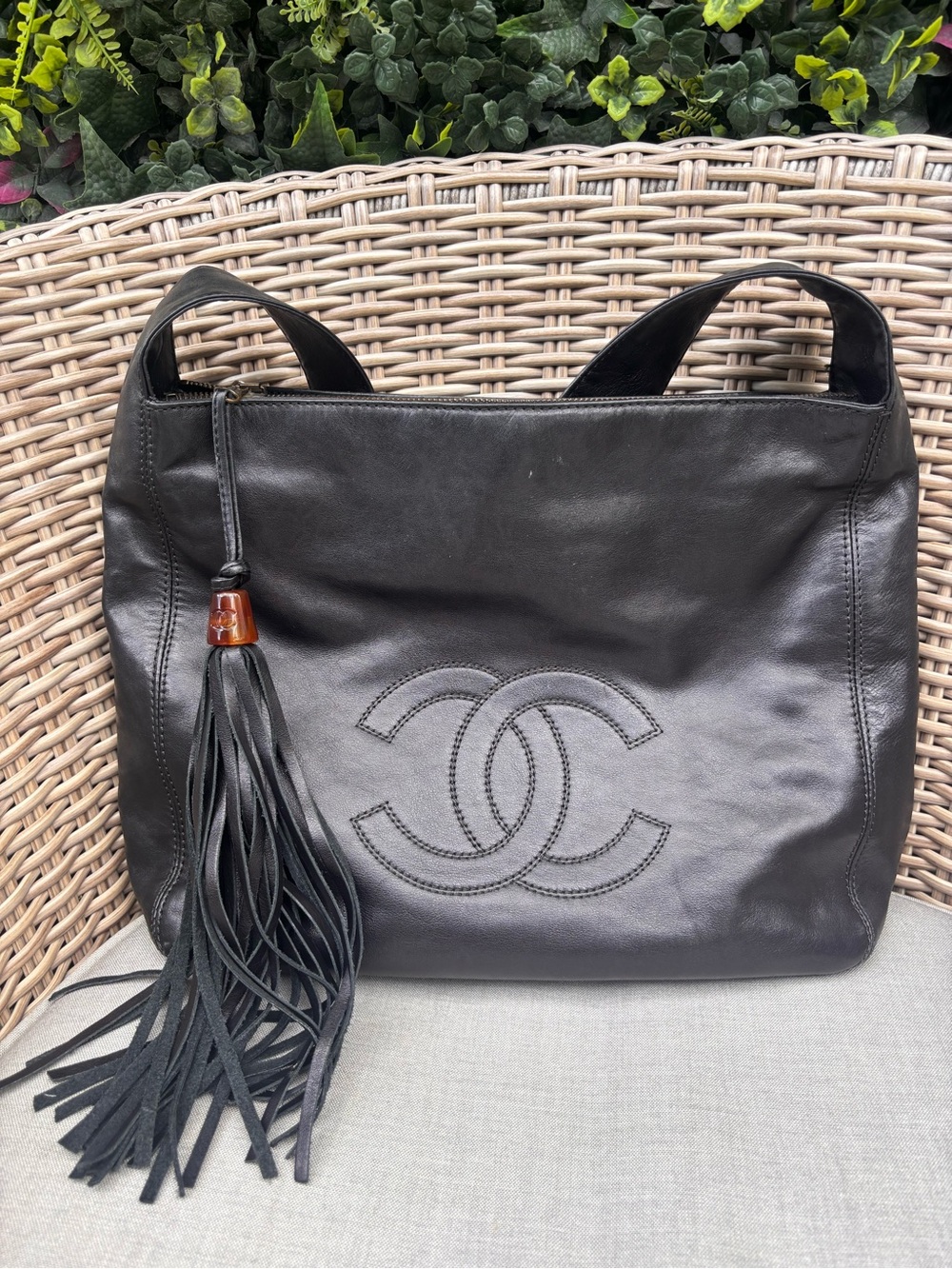 Authentic CHANEL black lambskin oversized tassel fringe shoulder bag